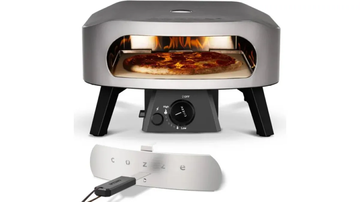 Gas-Pizzaofen auf Terrasse mit Flamme sichtbar und geöffneter Lade